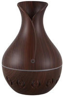 Casey Ultrasonic Aroma Humidifier Dark Hollow Wood Grain Finish With Creative Pattern Base – 200ml Water Capacity Vase Shaped Design With Creative Pattern Wood Base 7 Soothing LED Lights USB Powered Purifies And Humidifies Air For Home Office And Car