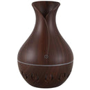 Casey Ultrasonic Aroma Humidifier Dark Hollow Wood Grain Finish With Creative Pattern Base – 200ml Water Capacity Vase Shaped Design With Creative Pattern Wood Base 7 Soothing LED Lights USB Powered Purifies And Humidifies Air For Home Office And Car
