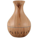 Casey Ultrasonic Aroma Humidifier Light Hollow Wood Grain Finish With Creative Pattern Base – 200ml Water Capacity Vase Shaped Design With Creative Pattern Wood Base 7 Soothing LED Lights USB Powered Purifies And Humidifies Air For Home Office And Car