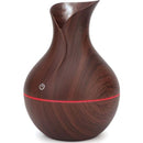 Casey Ultrasonic Aroma Portable Humidifier Dark Hollow Wood Grain Finish With Plain Base - 200ml Water Capacity Vase Shaped Design with Plain Pattern Wood Base. 7 Soothing LED Lights USB Powered Purifies And Humidifies Air For Home Office And Car