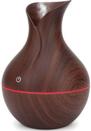 Casey Ultrasonic Aroma Portable Humidifier Dark Hollow Wood Grain Finish With Plain Base - 200ml Water Capacity Vase Shaped Design with Plain Pattern Wood Base. 7 Soothing LED Lights USB Powered Purifies And Humidifies Air For Home Office And Car
