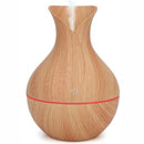 Casey Ultrasonic Aroma Portable Humidifier Light Hollow Wood Grain Finish With Plain Base- 200ml Water Capacity Vase Shaped Design with Plain Pattern Wood Base. 7 Soothing LED Lights USB Powered Purifies And Humidifies Air For Home Office And Car