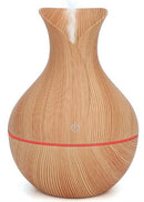 Casey Ultrasonic Aroma Portable Humidifier Light Hollow Wood Grain Finish With Plain Base- 200ml Water Capacity Vase Shaped Design with Plain Pattern Wood Base. 7 Soothing LED Lights USB Powered Purifies And Humidifies Air For Home Office And Car